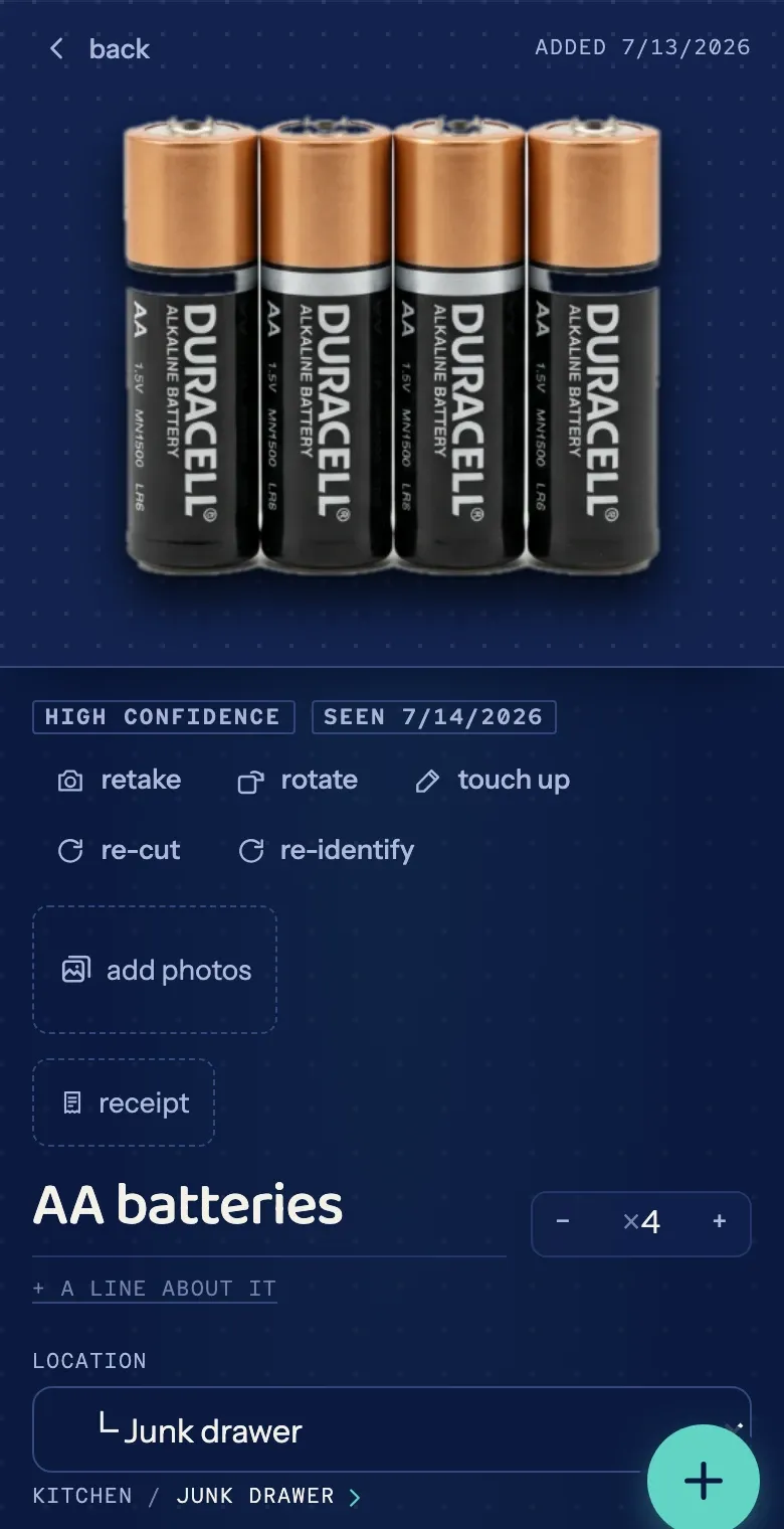 An item card for AA batteries: the cutout, confidence and last-seen chips, retake and re-cut controls, and its location, Kitchen / Junk drawer.